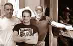 At Bulldog's brassy new front door: 
Hank, Jeff, and Ed