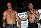 Bare chest contestant L. Ron with MC Scott at Powerhouse